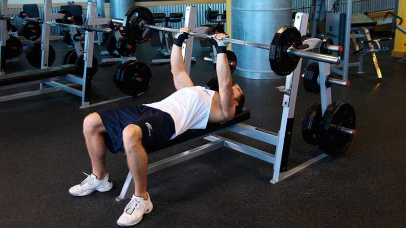 To dry the shoulders and chest, the barbell bench press is performed on a horizontal bench. 